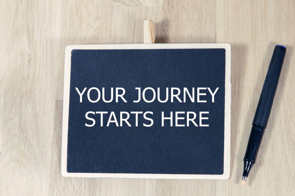 Bord met de tekst Your journey starts here